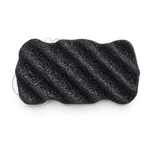 Charcoal black konjac body sponge with diagonal ridges and a white hanging string, on a white background.