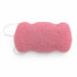 Flat, porous underside of a dusty pink konjac body sponge with a white hanging string on a white background.