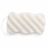 White textured konjac body sponge with diagonal ridges and a hanging string, shown on a white backdrop.