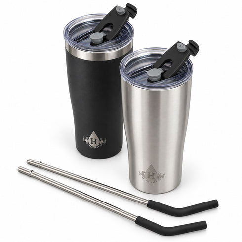Heritage tumblers with flip-back spout lids open, beside two stainless steel straws with silicone tips